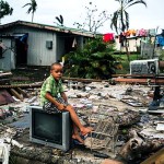 On 26 February 2016, Uraia, 7, sitting on a TV set on the remains of his home, that was destroyed by Cyclone Winston. Uraia's house is located a few metres from the shoreline, where there were strong storm surges at the height of the cyclone. Category 5 Tropical Cyclone Winston made landfall in Fiji on Saturday 20 February, continuing its path of destruction into Sunday 21 February. A state of natural disaster and a nationwide curfew had been declared by the Government of Fiji earlier in the evening. In the wake of Cyclone Winston, UNICEF's main concern is for children, pregnant women and breastfeeding mothers across Fiji. Little is yet known about the status of communities living on the outer islands of Fiji that were directly under the eye of Tropical Cyclone Winston- as communications remain down for many. The Fijian Government is rapidly working to assess the overall situation in order to pinpoint the critical needs. The Fijian Government has declared a state of natural disaster for the next 30 days and has initiated the clean-up process by clearing the huge amounts of debris scattered everywhere. UNICEF staff members are standing by to assist as required.